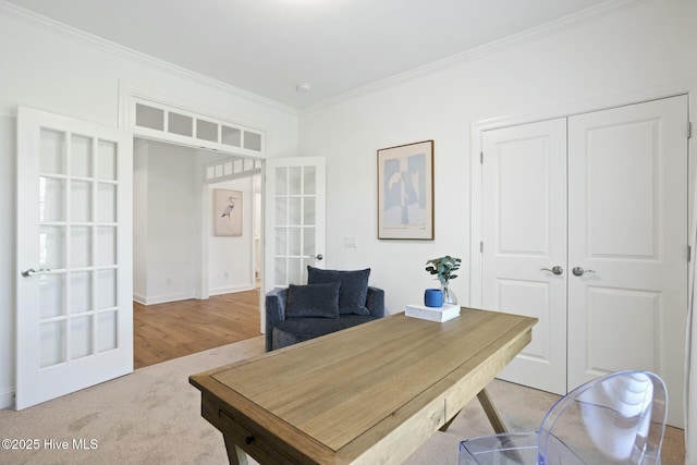 office featuring light colored carpet, french doors, and crown molding