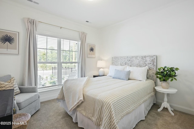 carpeted bedroom with ornamental molding