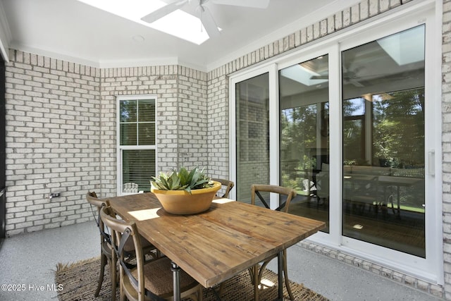 sunroom / solarium with ceiling fan