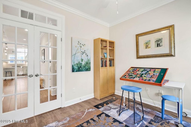 misc room with ceiling fan, dark hardwood / wood-style floors, ornamental molding, and french doors