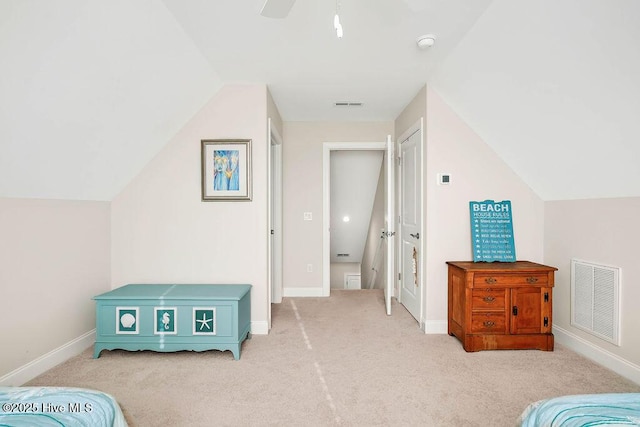 carpeted bedroom with ceiling fan and lofted ceiling