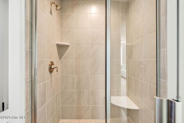 bathroom with tiled shower