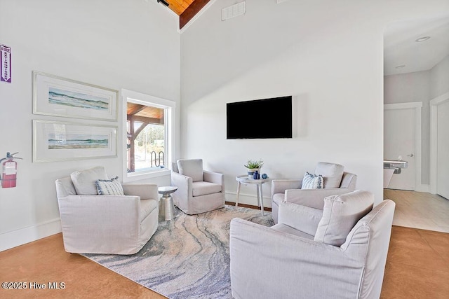 living room featuring high vaulted ceiling