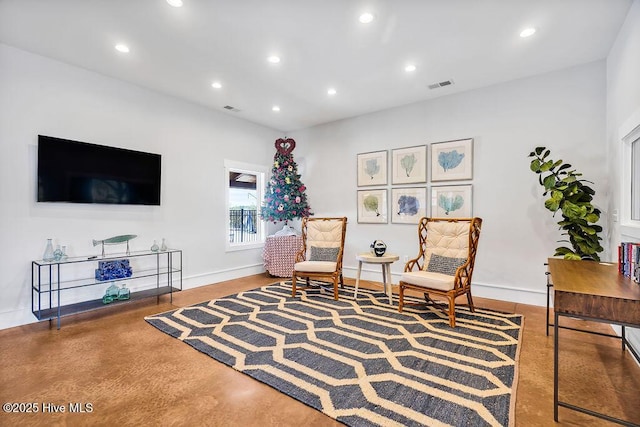 living area with concrete floors