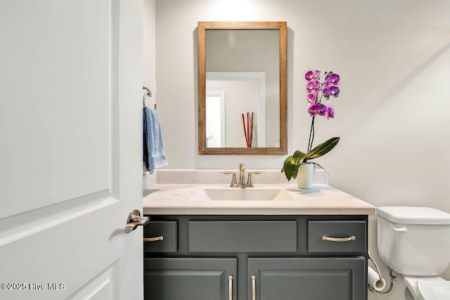 bathroom with toilet and vanity