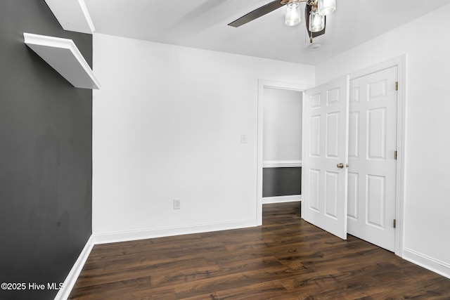 unfurnished bedroom with a closet, ceiling fan, and dark hardwood / wood-style floors