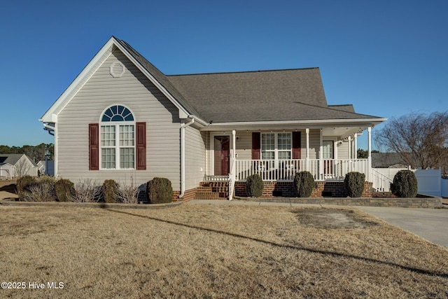 view of front facade with covered porch and a front lawn