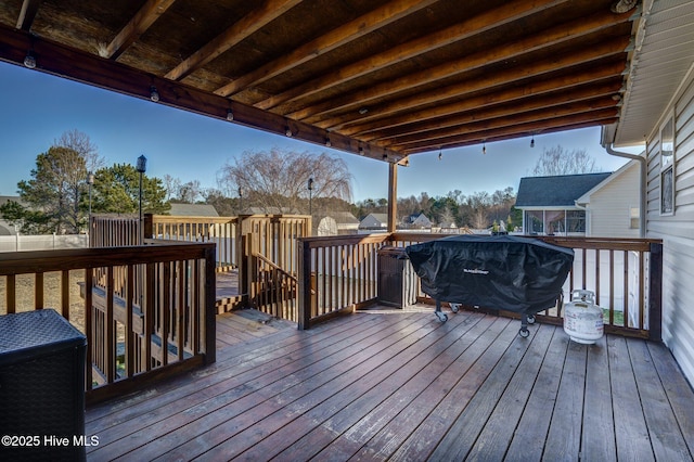 wooden terrace with grilling area