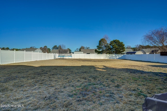 view of yard with a trampoline