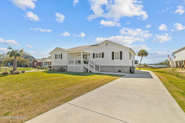 view of front of property with a porch and a front lawn