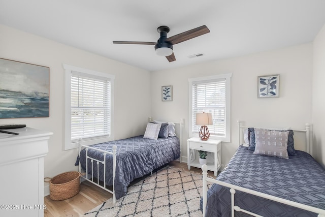 bedroom featuring wood-type flooring and ceiling fan