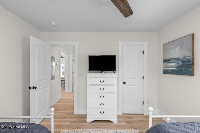 bedroom with hardwood / wood-style flooring and ceiling fan