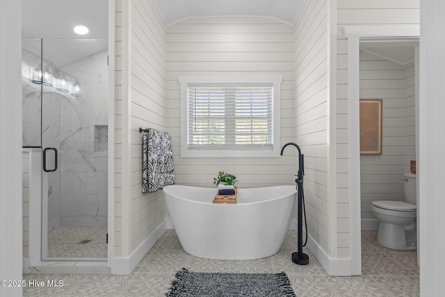 bathroom featuring plus walk in shower, lofted ceiling, toilet, and wood walls