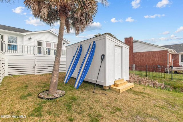 view of outbuilding with a yard