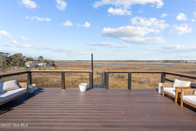 wooden deck with a rural view