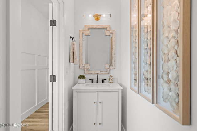 bathroom featuring vanity and hardwood / wood-style floors