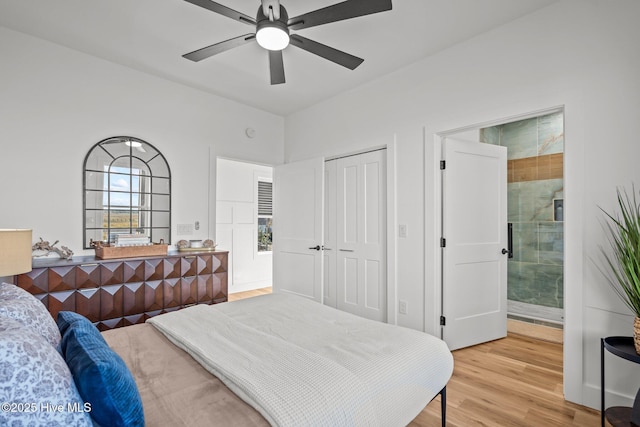 bedroom with connected bathroom, hardwood / wood-style floors, a closet, and ceiling fan