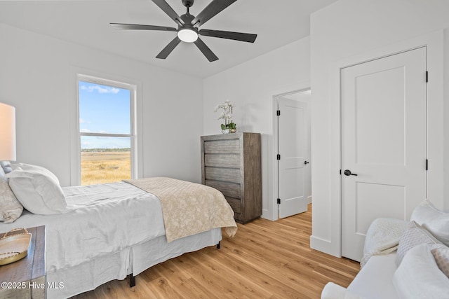 bedroom featuring ceiling fan and light hardwood / wood-style floors