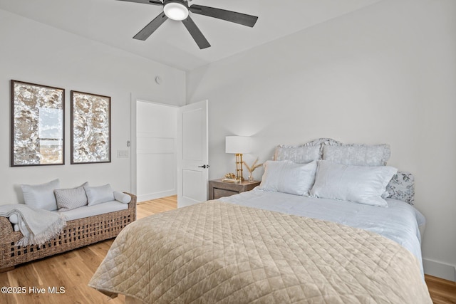 bedroom featuring hardwood / wood-style flooring and ceiling fan