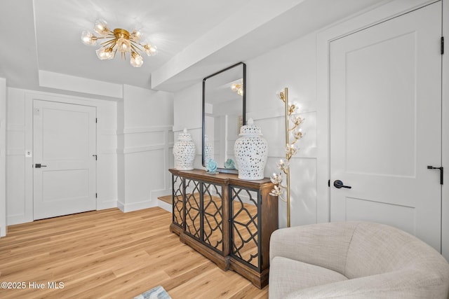 interior space featuring hardwood / wood-style floors and a notable chandelier