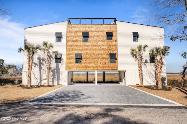 view of front of home with a carport