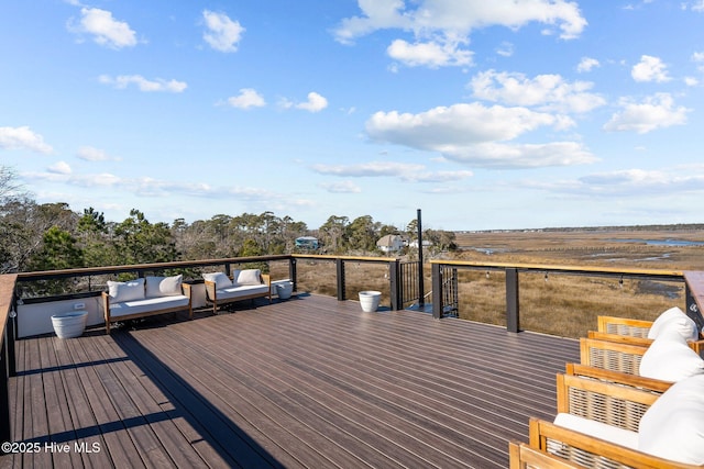 wooden terrace with outdoor lounge area