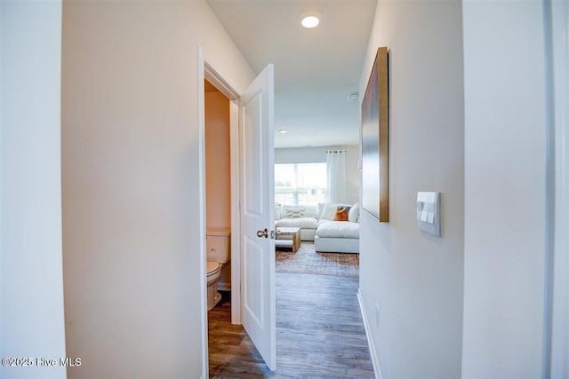 hallway featuring dark hardwood / wood-style floors