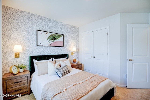 carpeted bedroom with a closet