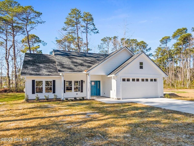 ranch-style home with a garage and a front lawn