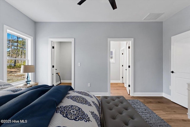 bedroom featuring wood-type flooring and ceiling fan