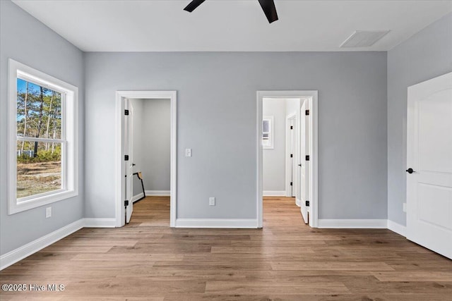 unfurnished bedroom featuring ceiling fan and light hardwood / wood-style floors