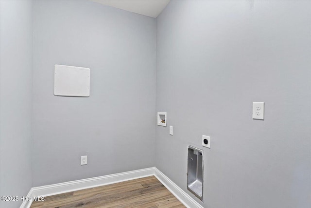 washroom featuring electric dryer hookup, hookup for a washing machine, and wood-type flooring