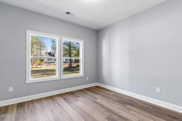 unfurnished room featuring light hardwood / wood-style flooring