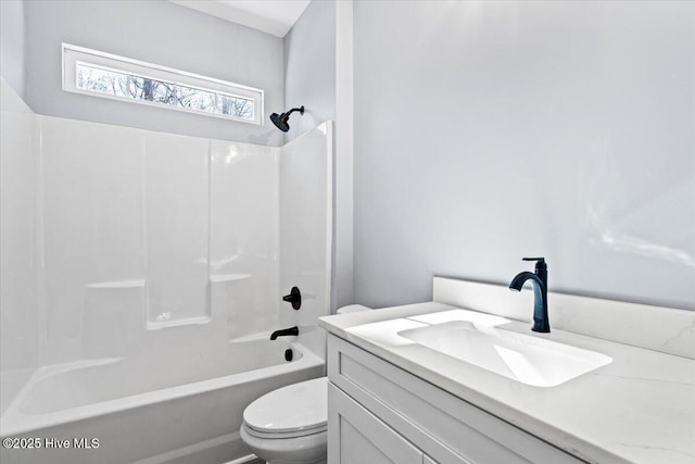 full bathroom featuring  shower combination, vanity, and toilet