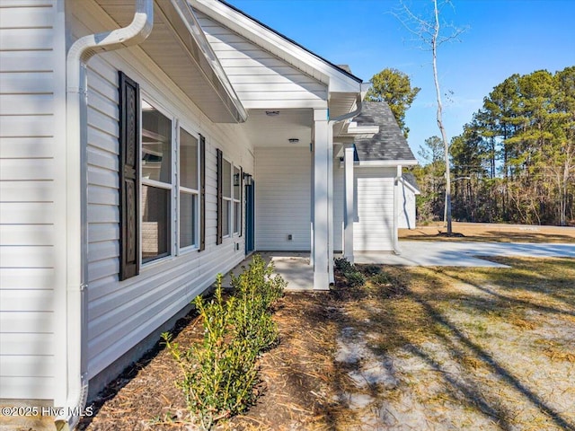 view of property exterior with a patio area