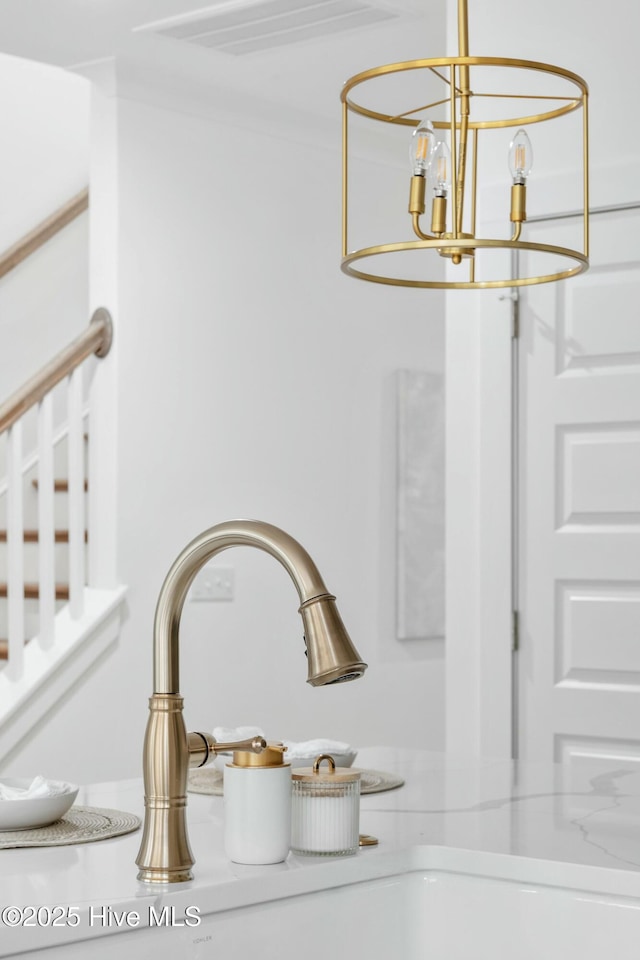 details featuring a notable chandelier and sink