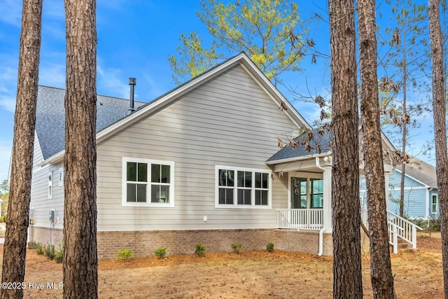 view of property exterior with a porch