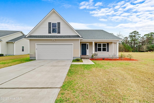 view of front of house featuring a front yard, a garage, and covered porch