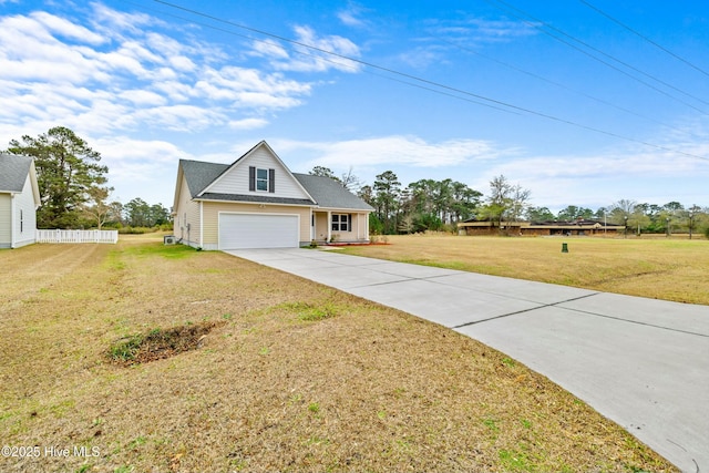 view of front of property with a front yard and a garage