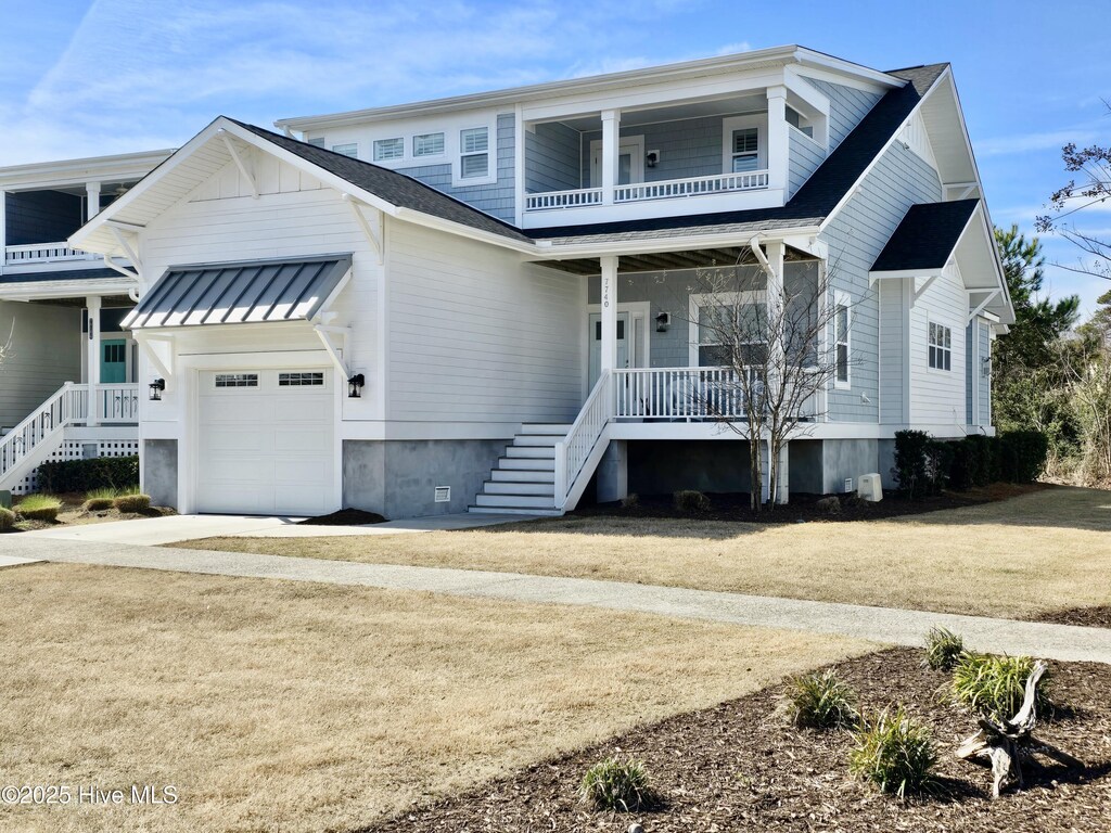 view of front of home with a porch and a balcony