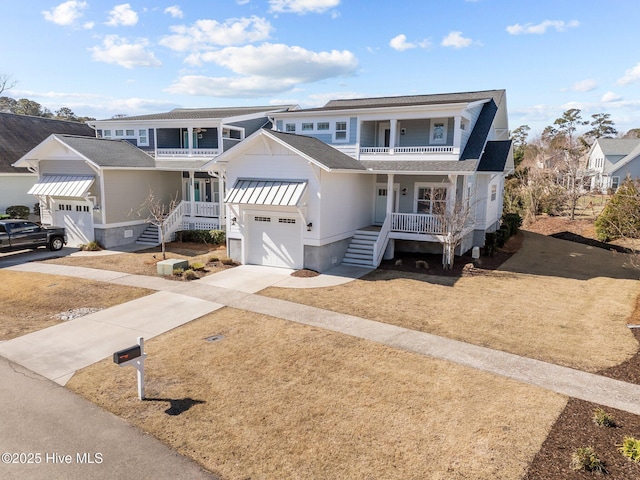 view of property with roof with shingles, a porch, a balcony, and a garage