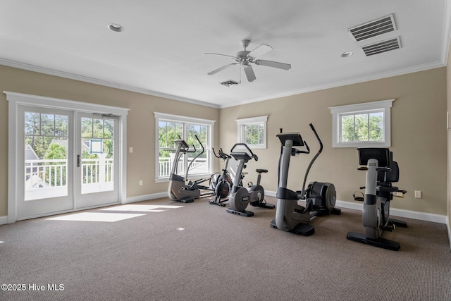 workout room featuring baseboards, visible vents, a ceiling fan, and ornamental molding