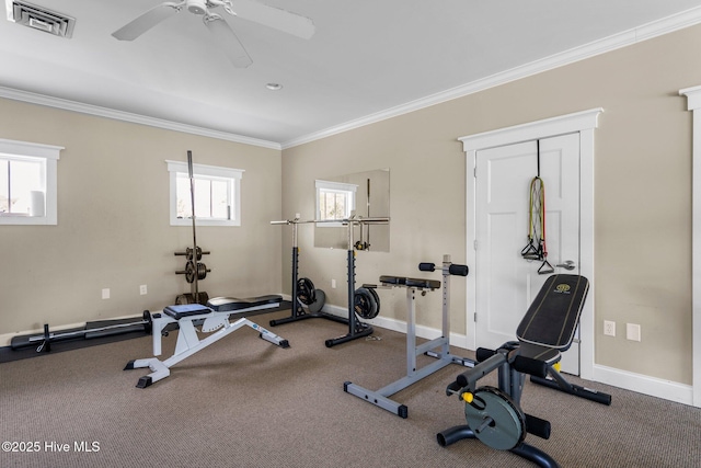 exercise area with a ceiling fan, visible vents, crown molding, and baseboards