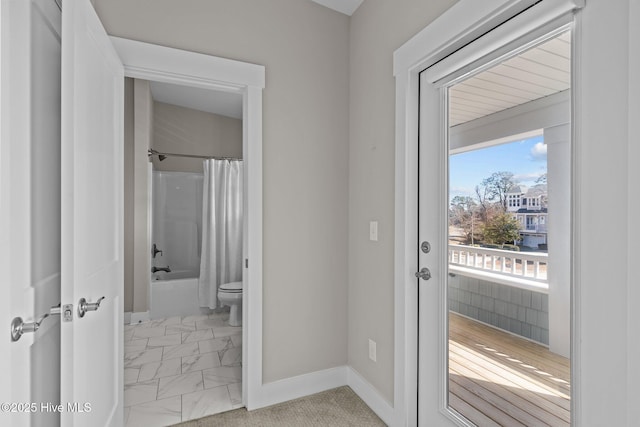 entryway featuring marble finish floor and baseboards