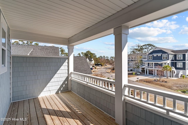 wooden deck with a residential view