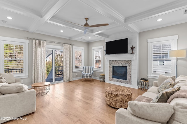 living room featuring hardwood / wood-style floors, beamed ceiling, and coffered ceiling