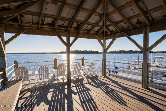 view of dock with a water view and a gazebo