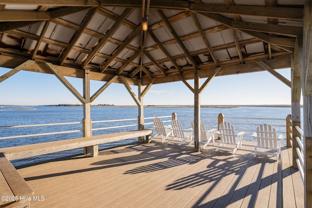 view of dock with a gazebo and a water view