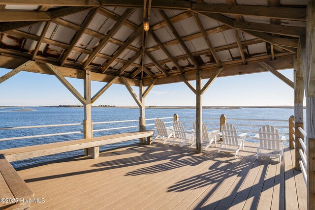 view of dock featuring a gazebo and a water view