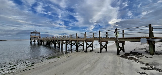 view of dock featuring a pier and a water view